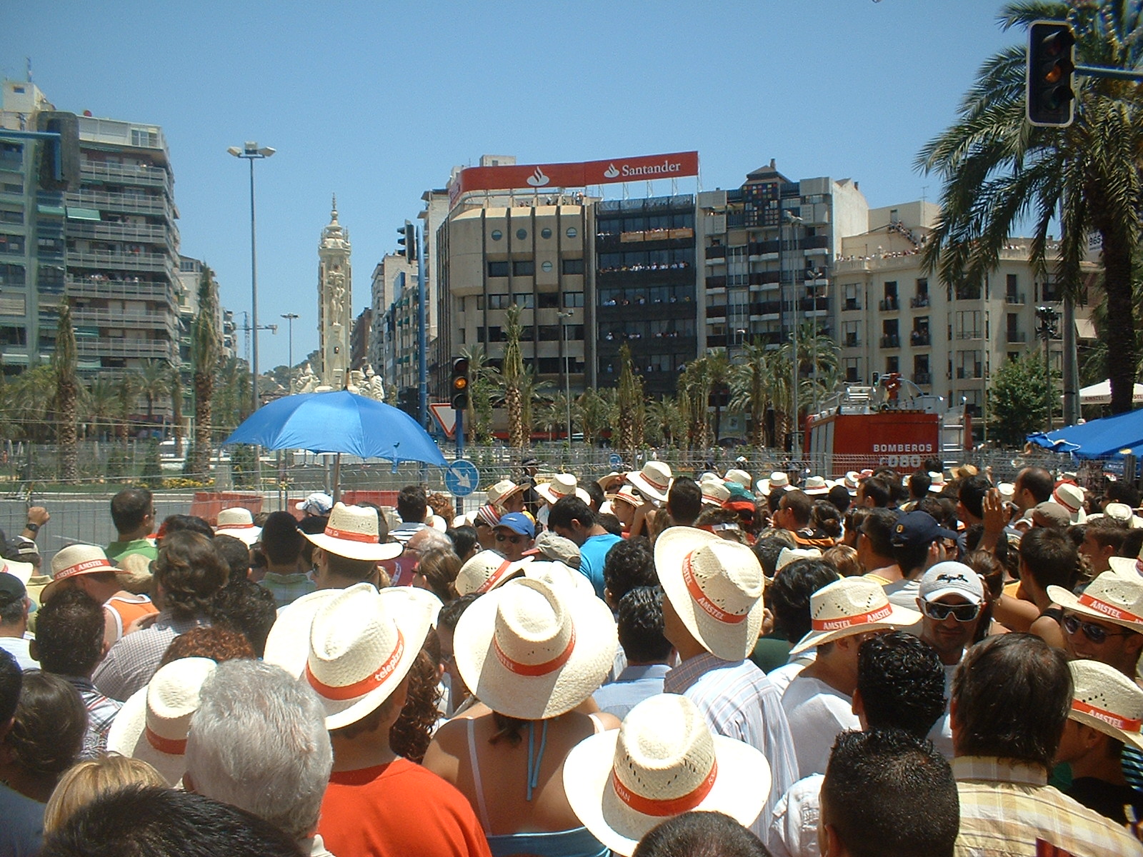 Crowd in straw hats at Alicante's Luceros square waiting for the mascletà