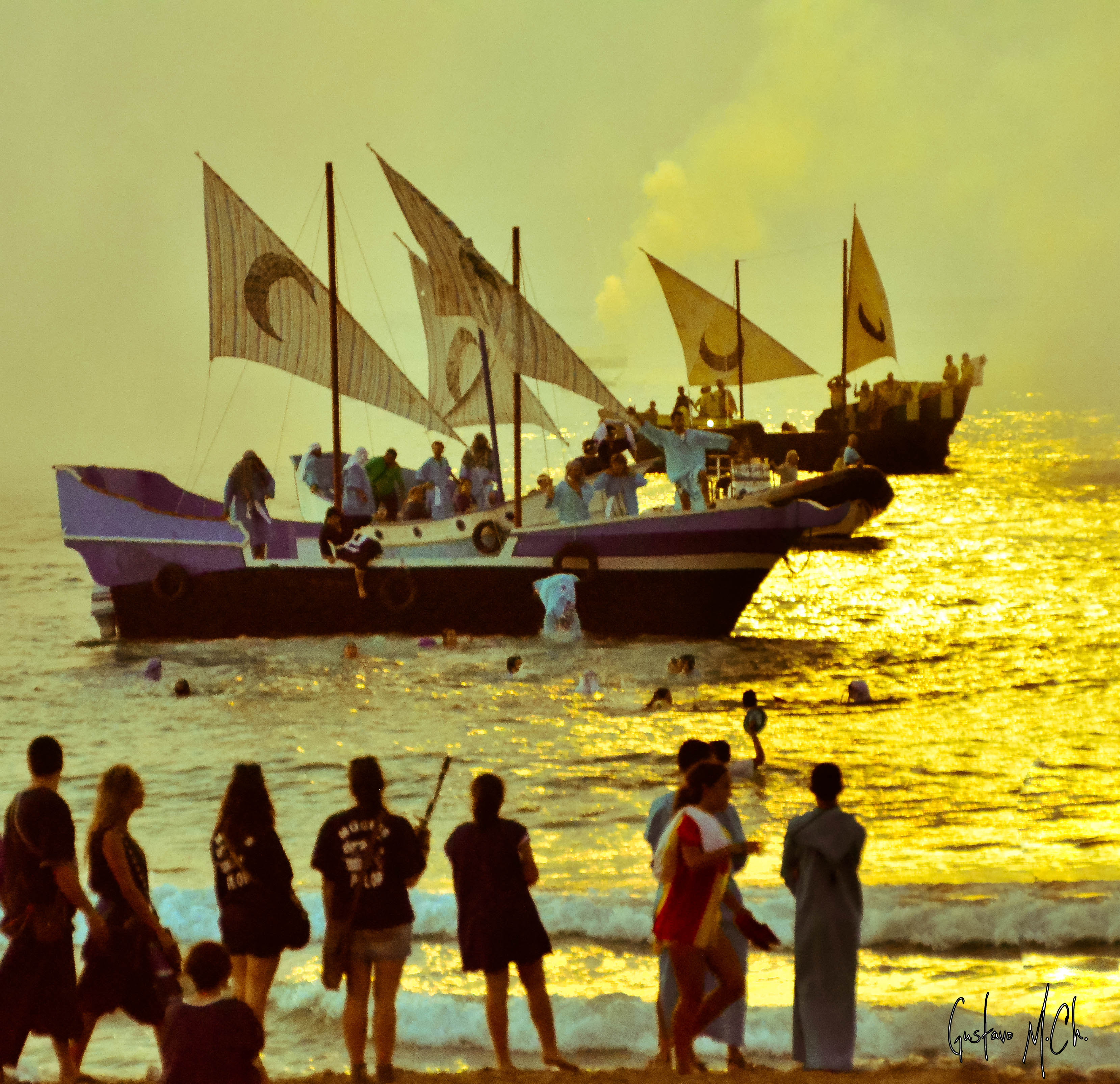 Moorish dawn landing on Villajoyosa's central beach with traditional boats